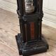 A pedestal table in blackened wood and burl veneer, superb assembly of moldings circa 1880