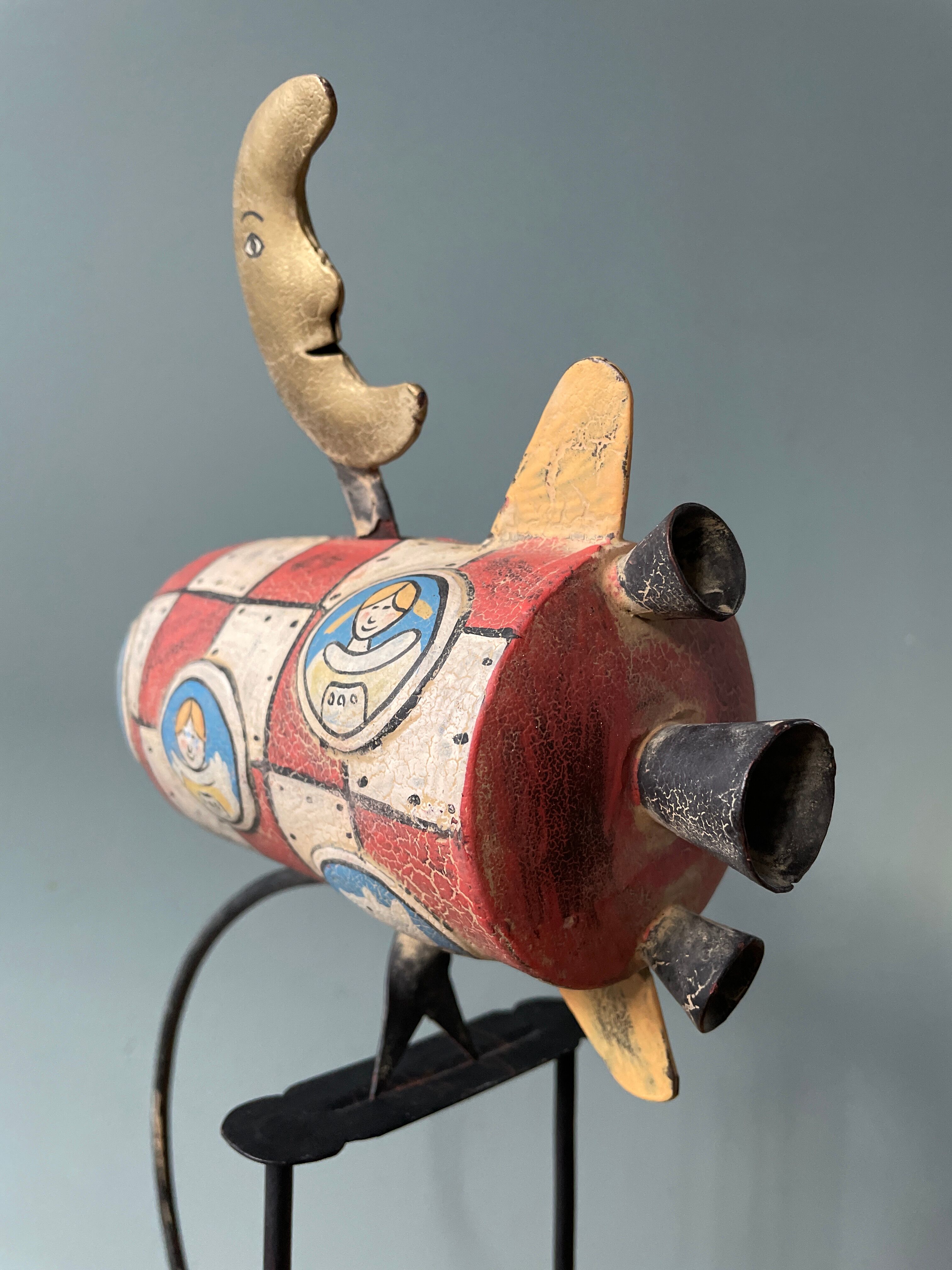 Old painted sheet metal pendulum toy