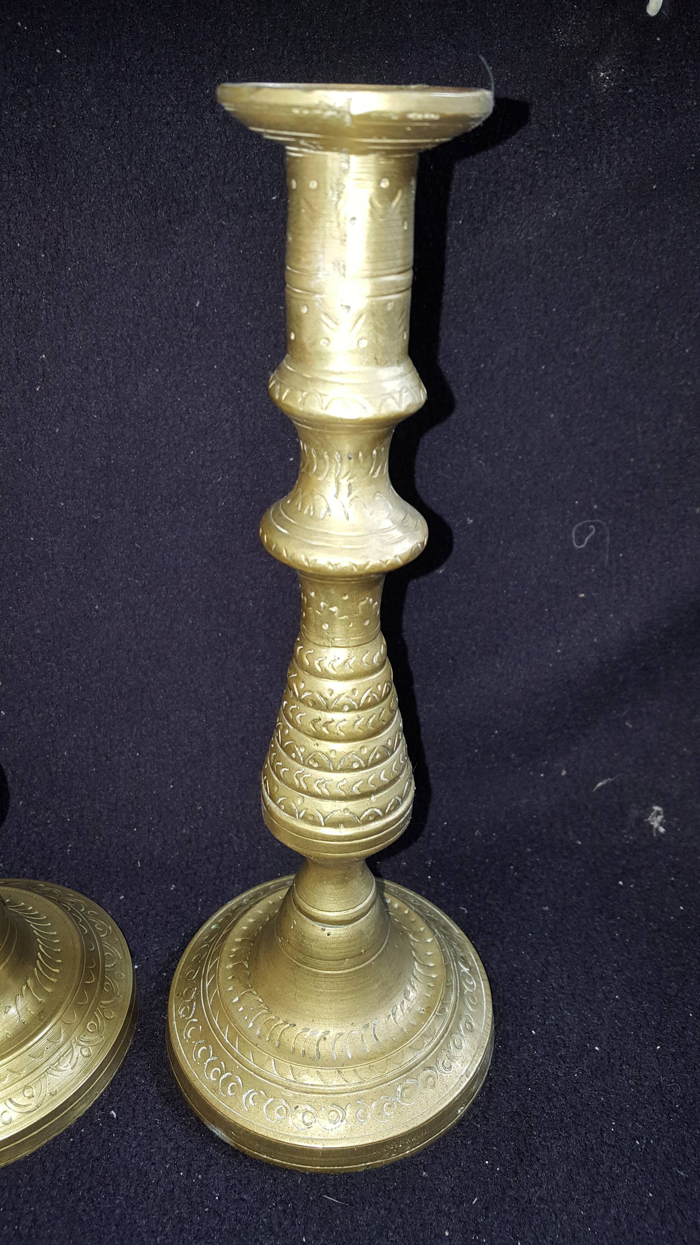 Former pair of bronze candlesticks