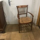 Curved armchair in wood and straw