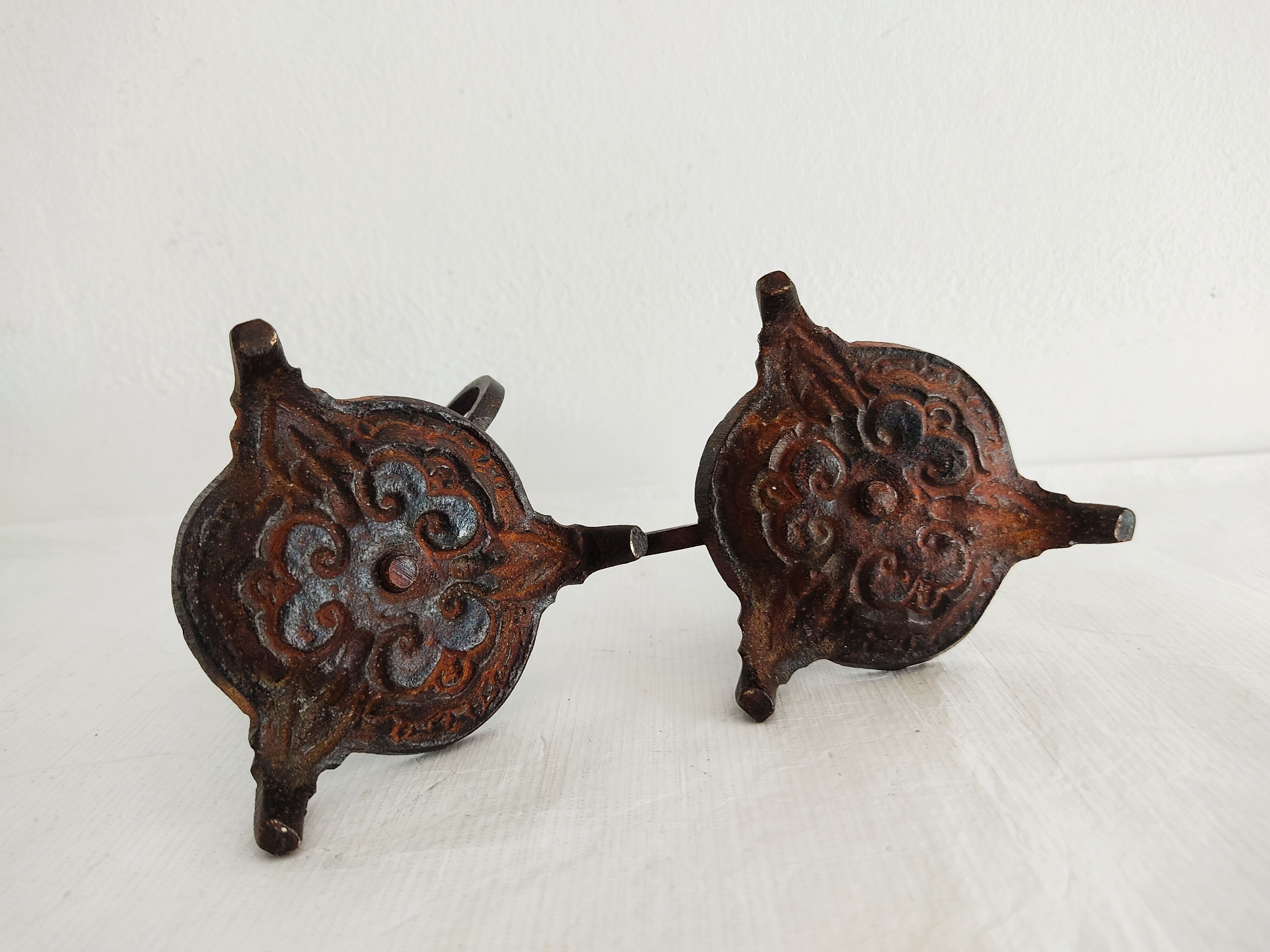 Pair of bronze hand-held candlesticks