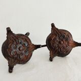 Pair of bronze hand-held candlesticks