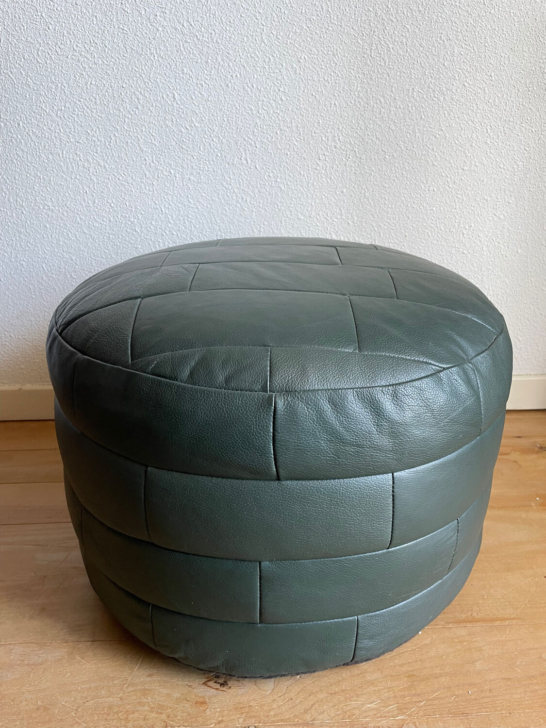 Green patchwork leather pouf from Sède