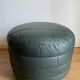 Green patchwork leather pouf from Sède