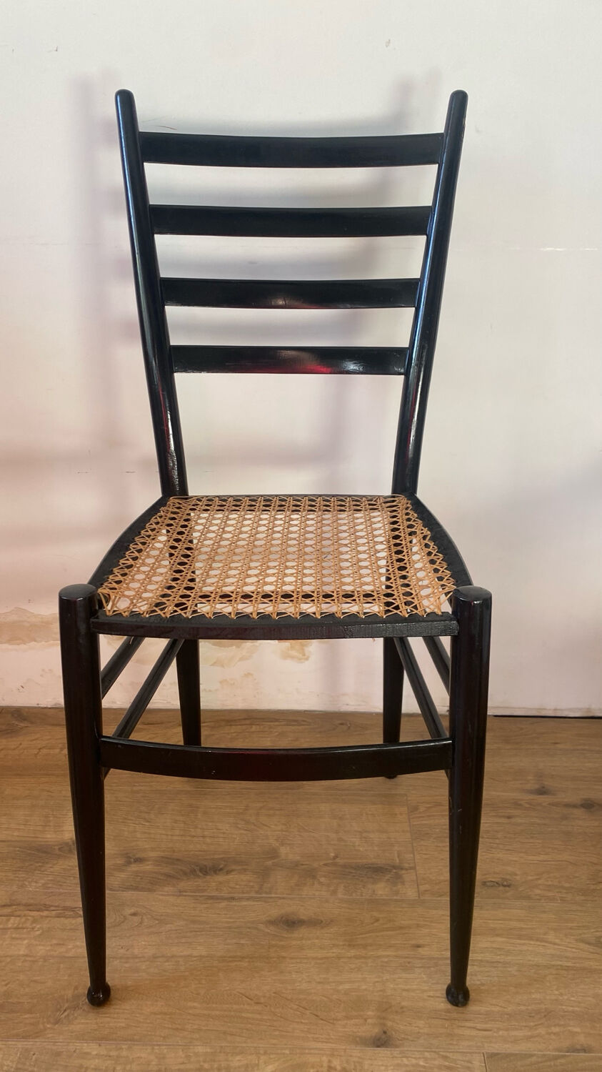 Light wooden chair with caning