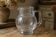 Vintage blown glass pitcher with bubbles, transparent.