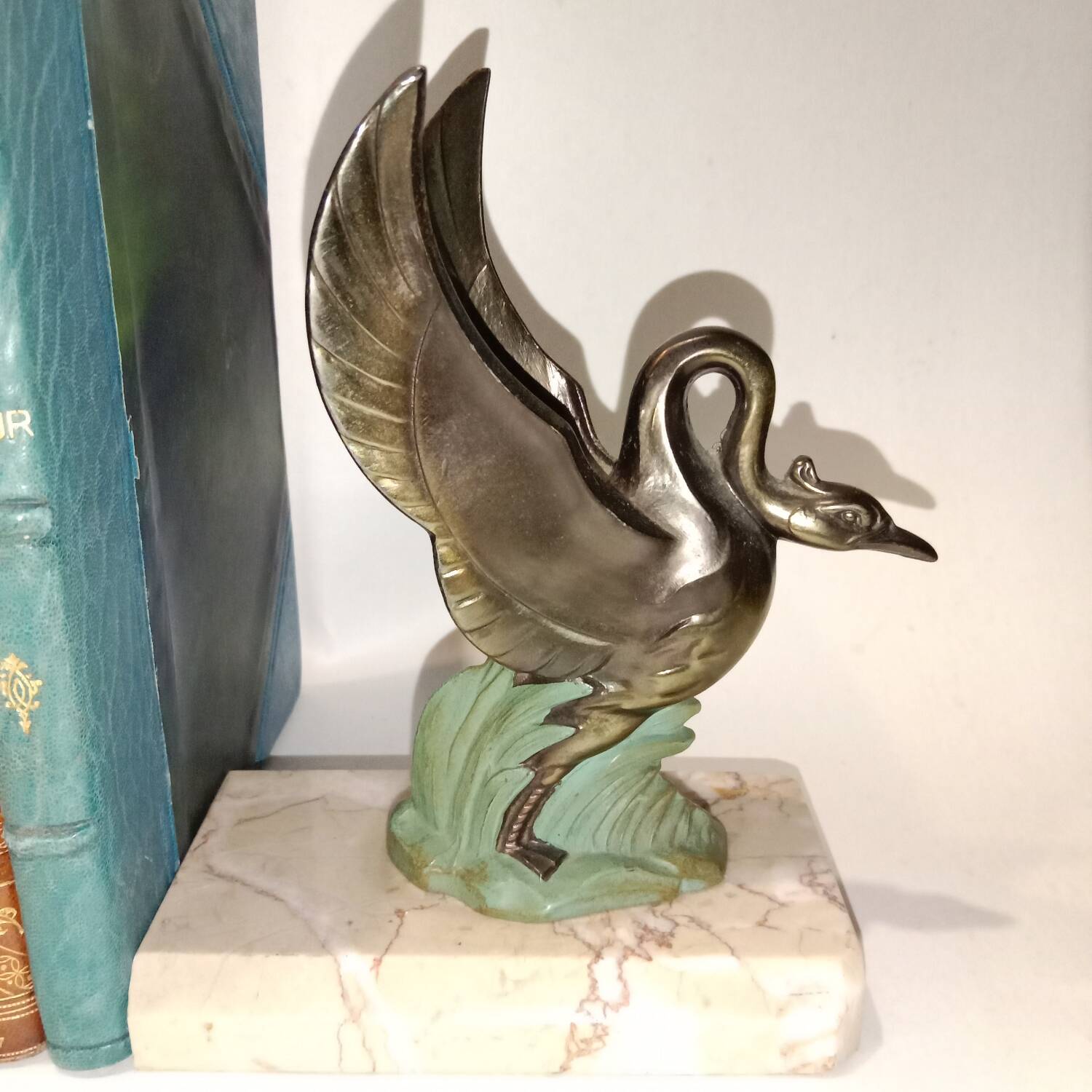 Art Deco bookends with metal swans, double patina and marble base.