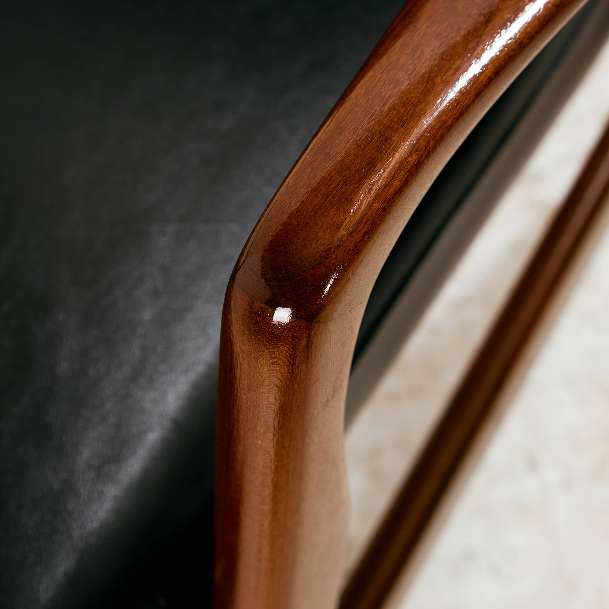 Teak armchair with leather upholstery