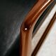 Teak armchair with leather upholstery