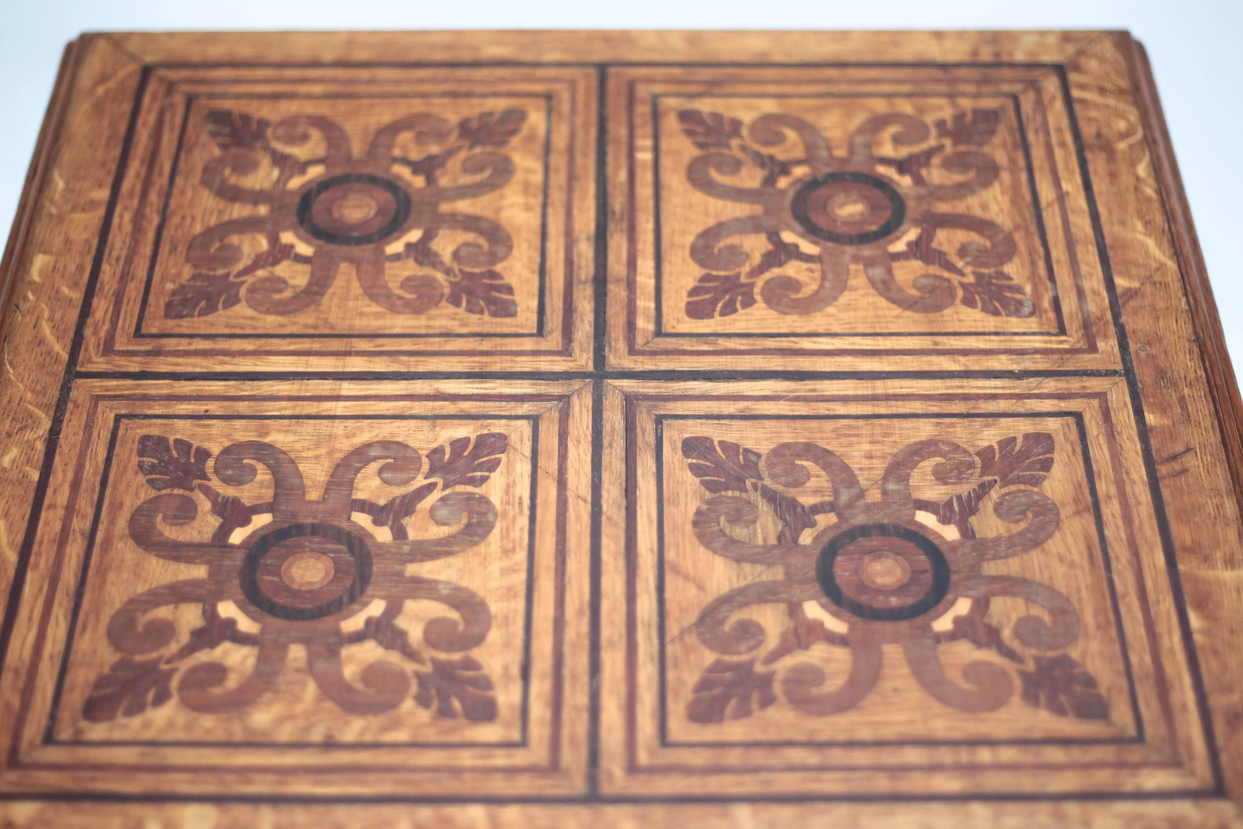 Wood table with marquetry, table with an antique parquet top, antique table.