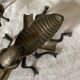 2 metal ashtrays with insect fly designs from the 1950s-60s.