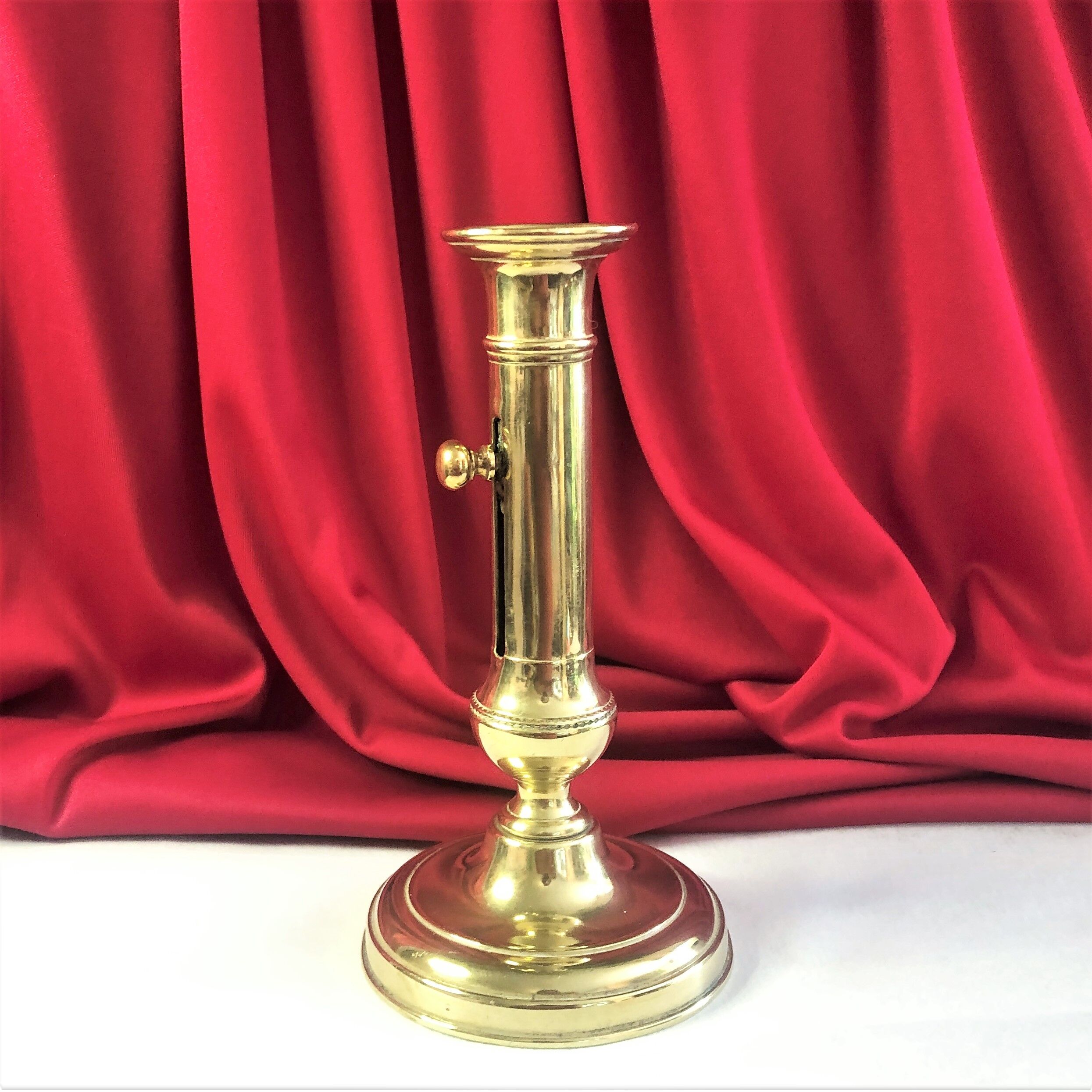Gilded copper push candle holder