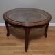 Table basse cannée en bois et verre