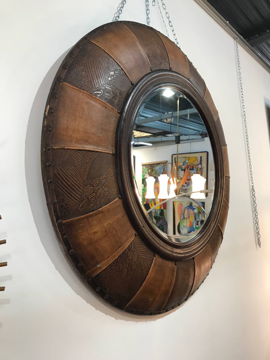 Large round leather mirror