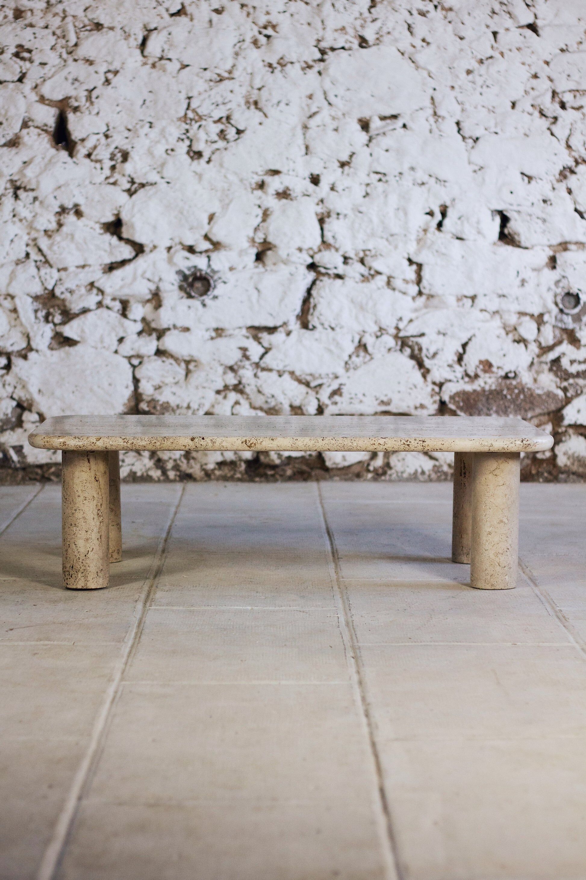 Travertine coffee table in the style of Angelo Mangiarotti, 1970.