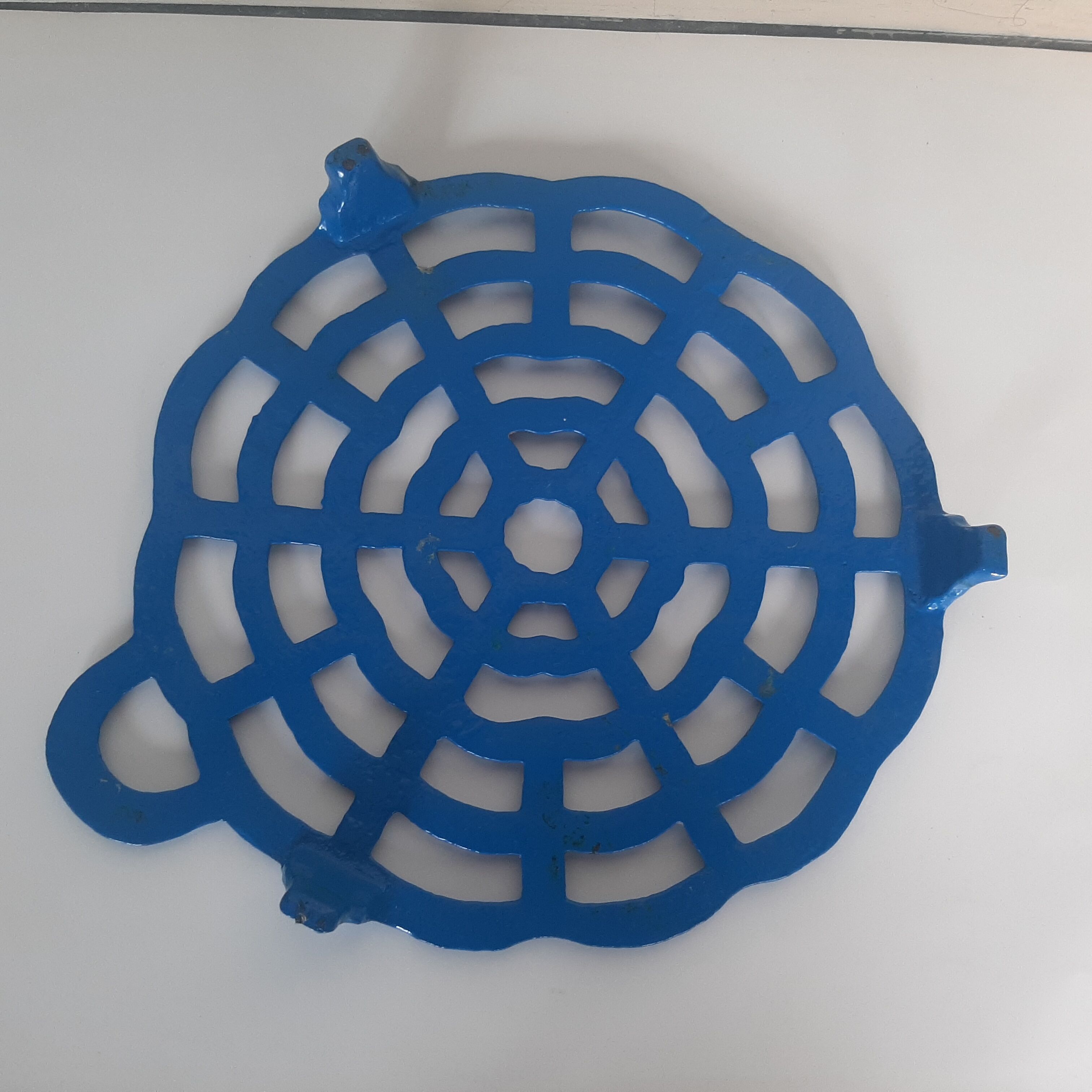 Old blue vintage enamelled table mat