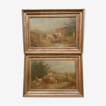 Pair of landscape framed cows