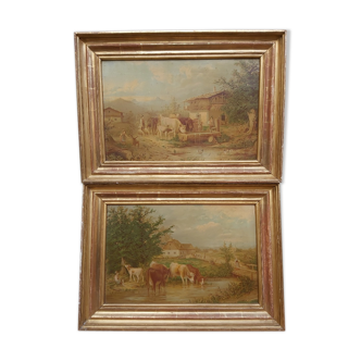 Pair of landscape framed cows