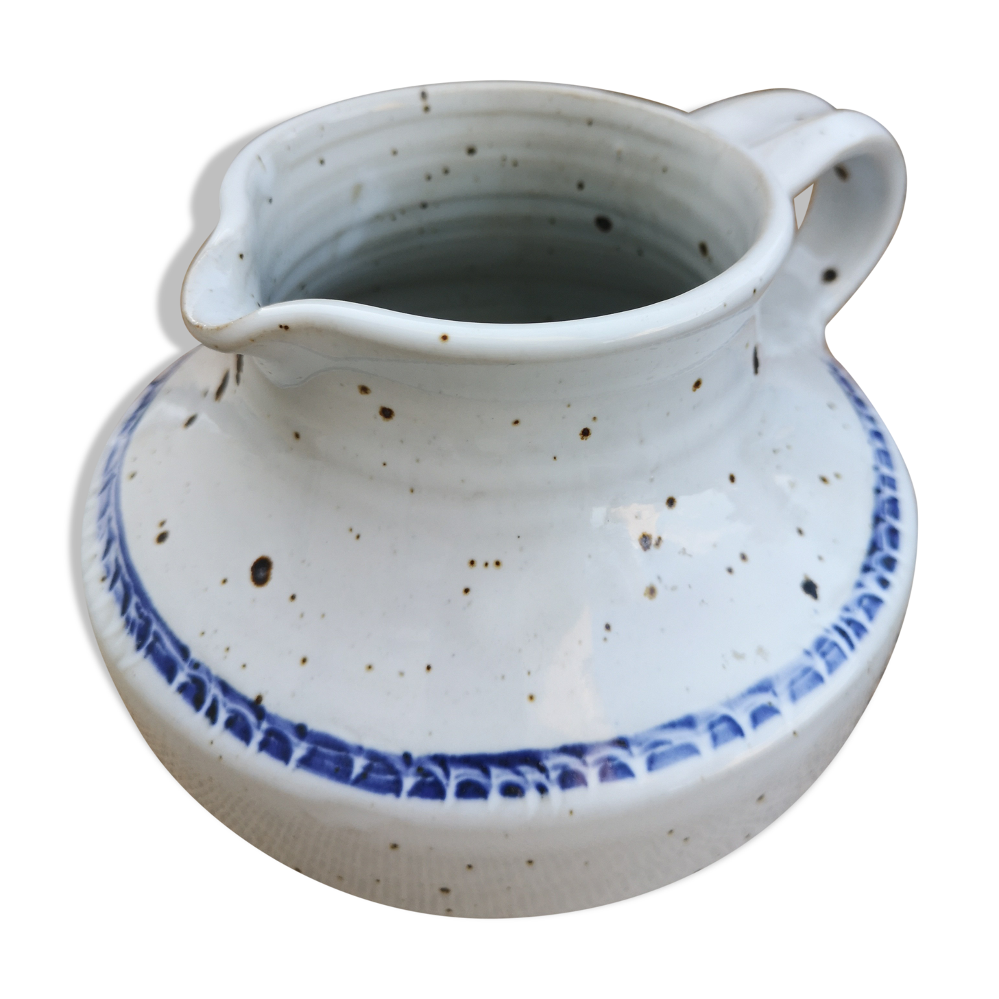 Pitcher in speckled sandstone
