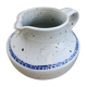 Pitcher in speckled sandstone