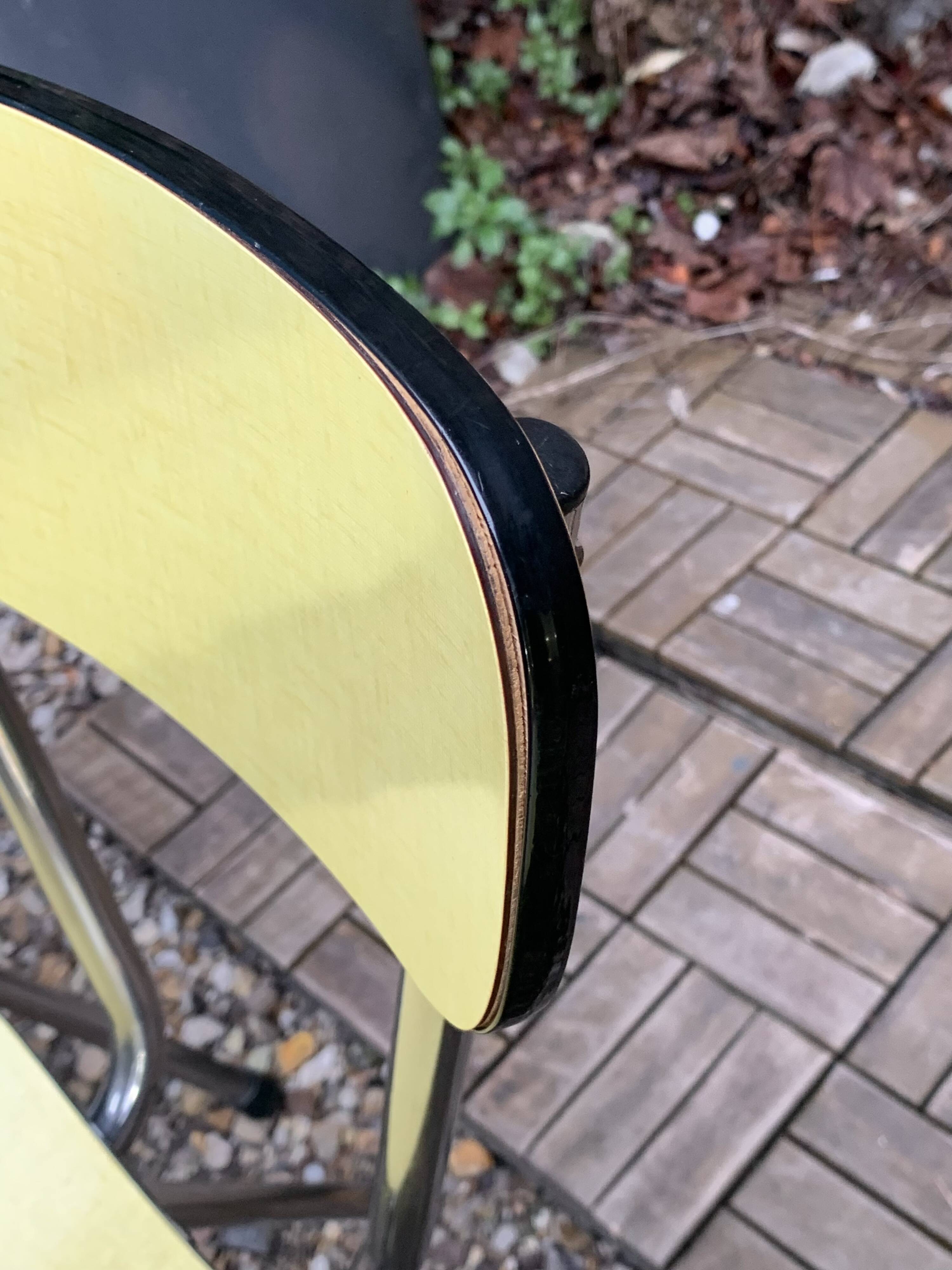 Yellow Formica chairs with compass legs, 1950s
