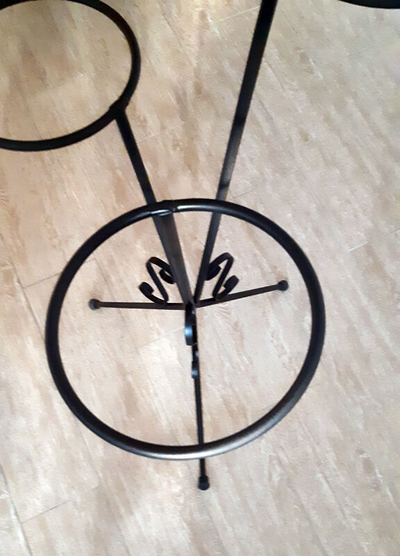 Plant holder in black wrought iron.