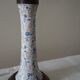 Table lamp for bedside use in earthenware with a wooden base.