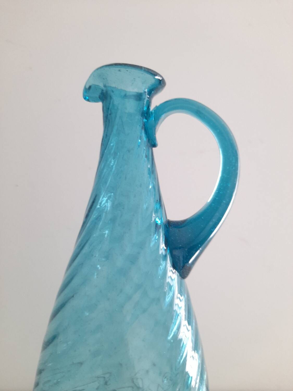 Tall twisted blue glass carafe