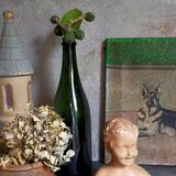 Bust of a small child in ancient plaster