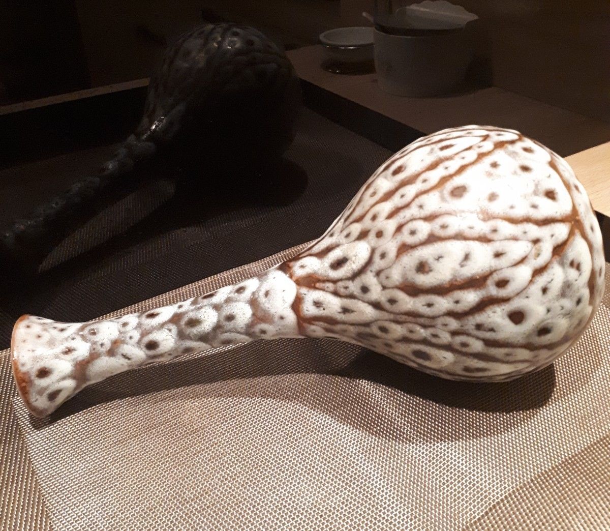 Long-necked vase from the 20s and 40s enamelled sandstone artist Tf's signature