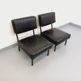 Set of 2 vintage modernist armchairs in black faux leather and metal.