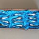 Lot 12 knife holders in the shape of a stylized whale or fish