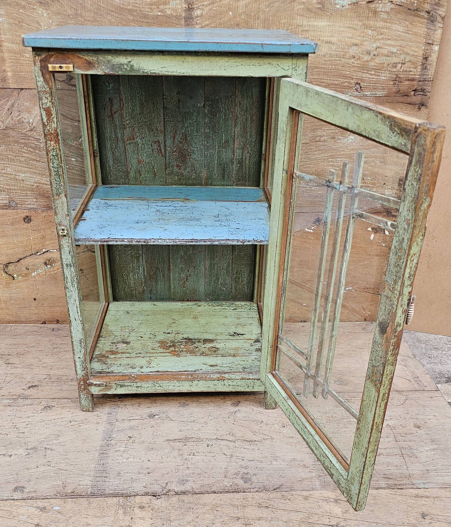 Art Deco glass-fronted bar cabinet in teak