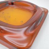 Empty-pocket in amber glass