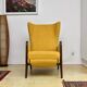 Yellow boucle wingback chair with folding footstool, 1950s