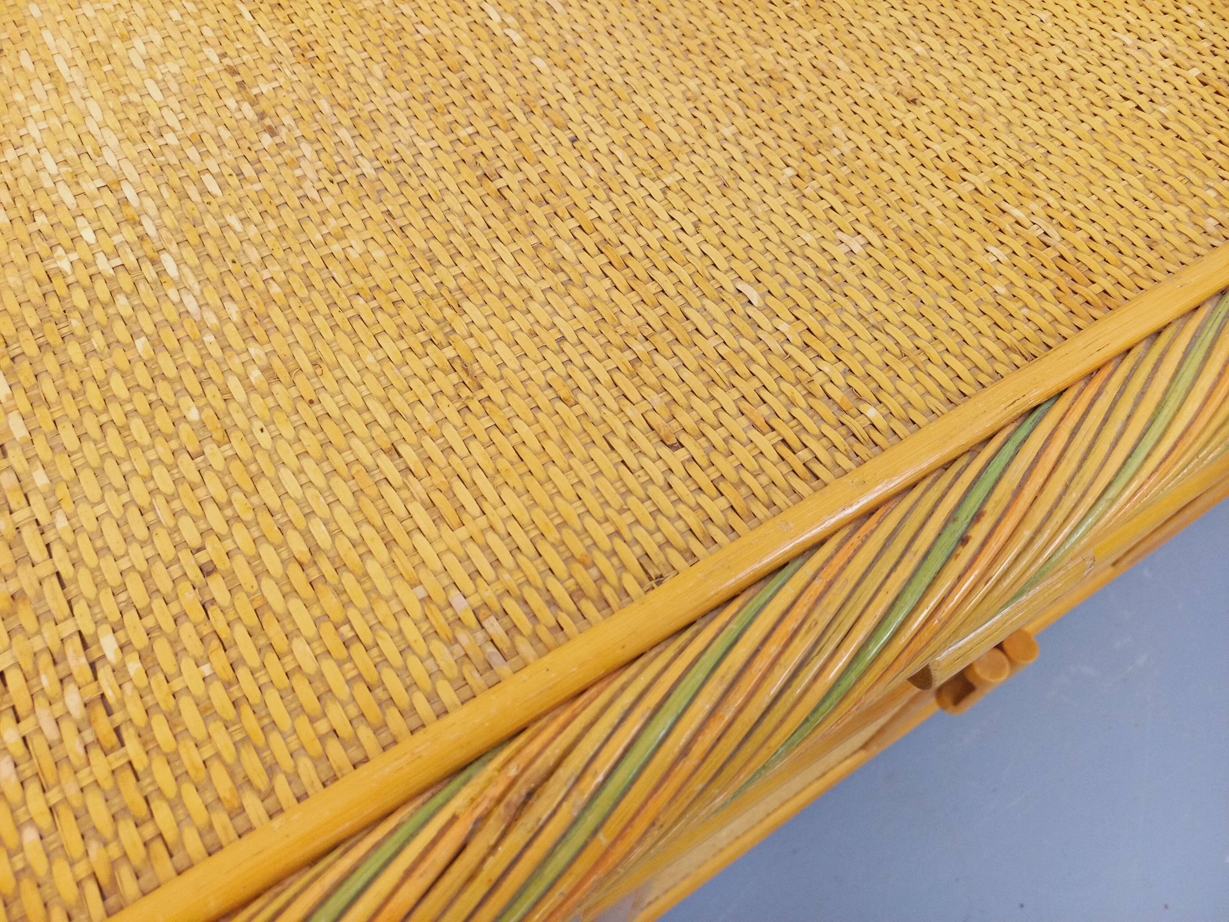 Vintage storage unit in rattan and woven rattan from the 1970s.