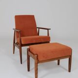 Vintage armchair and footrest in orange corduroy.