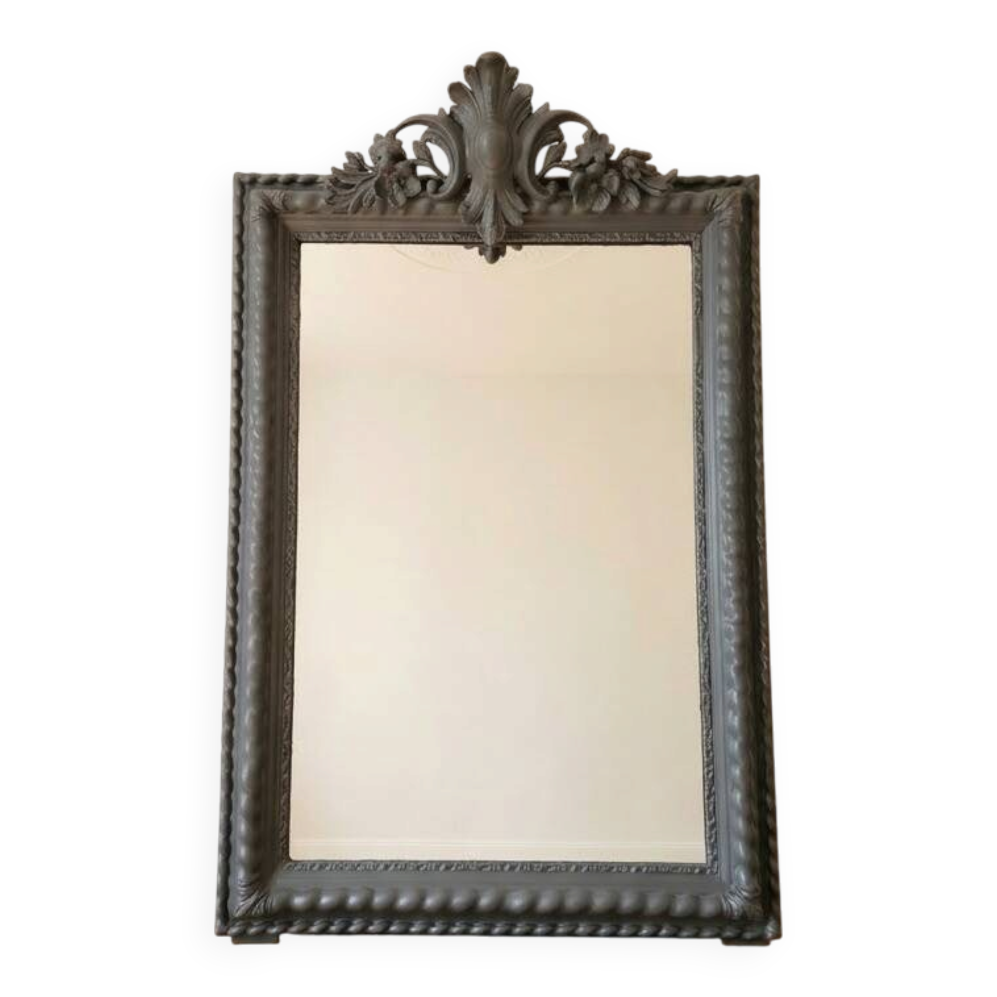 Antique mirror with a sculpted pediment in classic grey style.