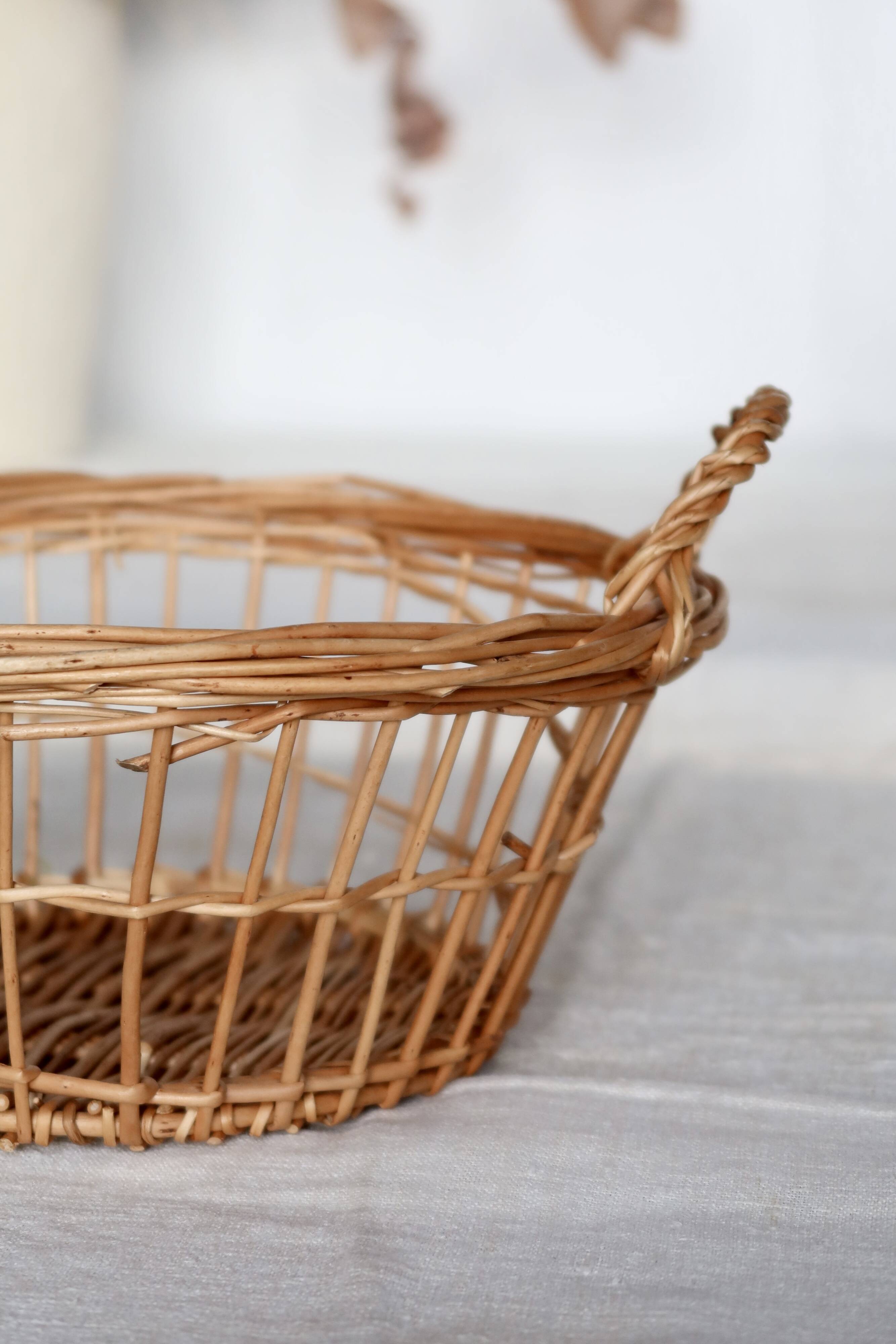 Round openwork wicker storage basket with braided handles
