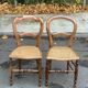 Two Louis Philippe cane chairs in solid carved wood from the 20th century