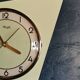 Vintage formica clock silent asymmetrical wall pendulum "Kienzle green"