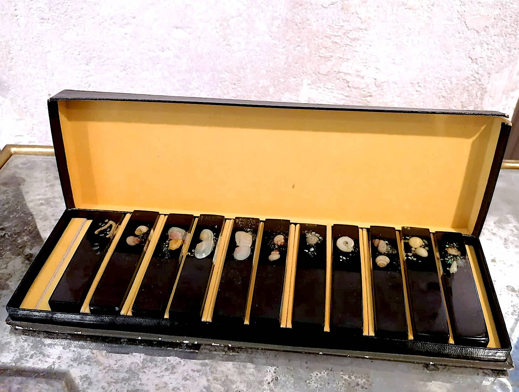 Set of 11 blackened resin knife holders, 1970s