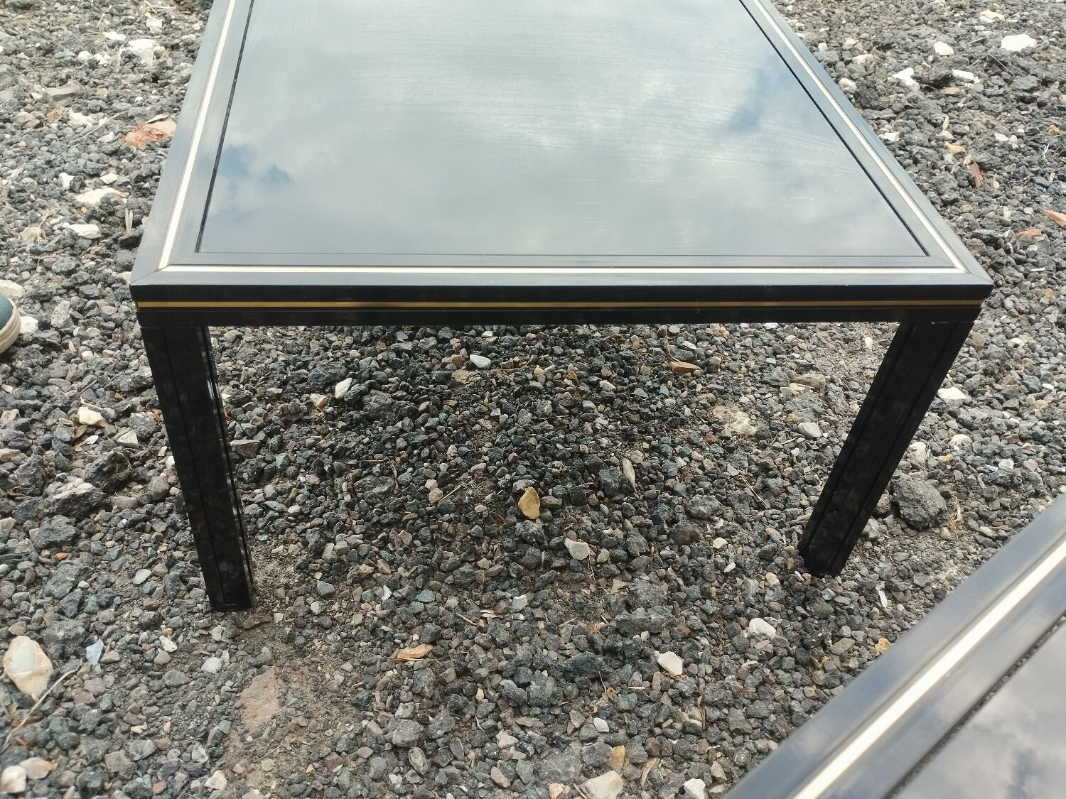 Vintage metal coffee table with glass top.