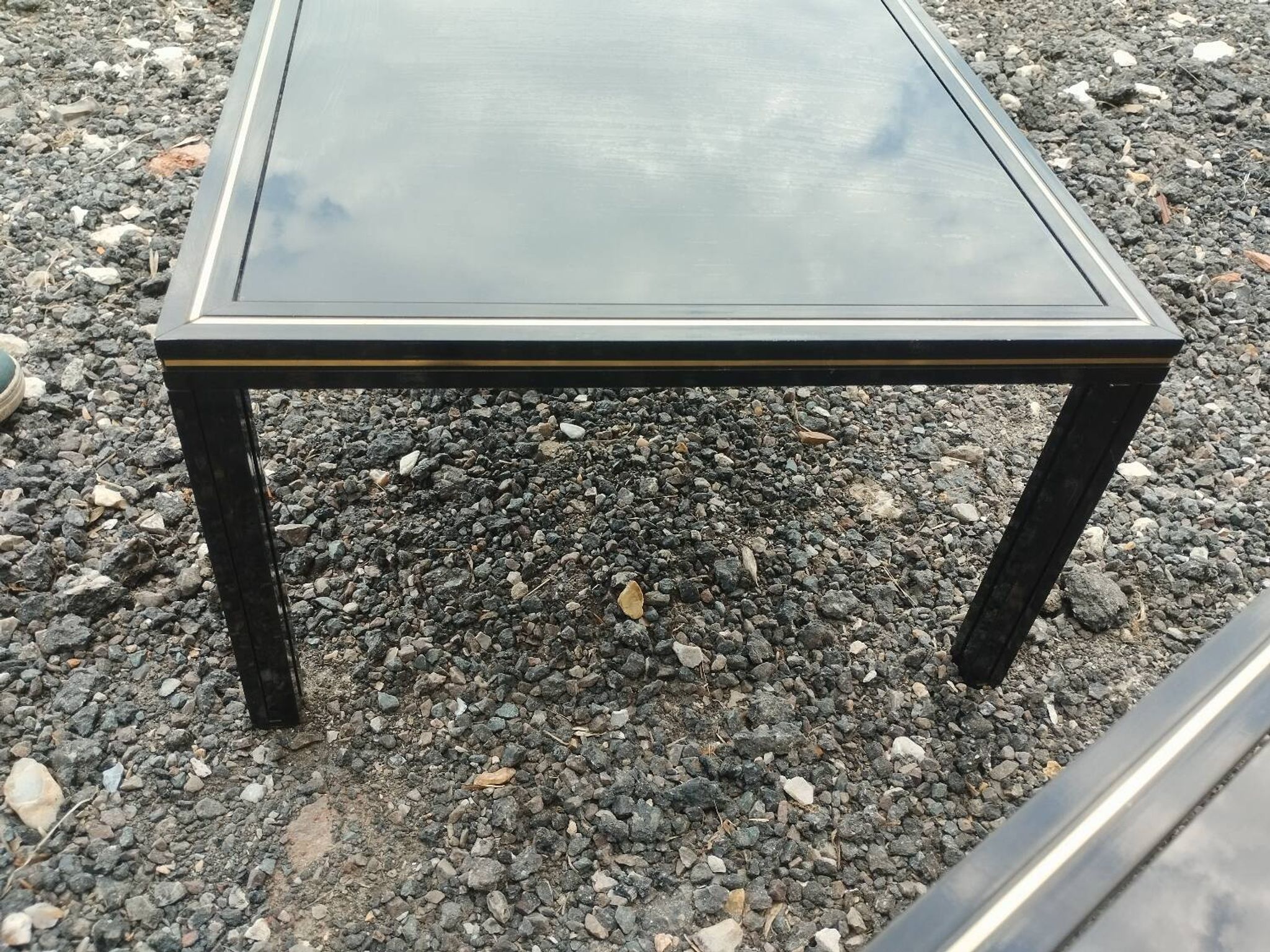 Vintage metal coffee table with glass top.