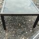 Vintage metal coffee table with glass top.