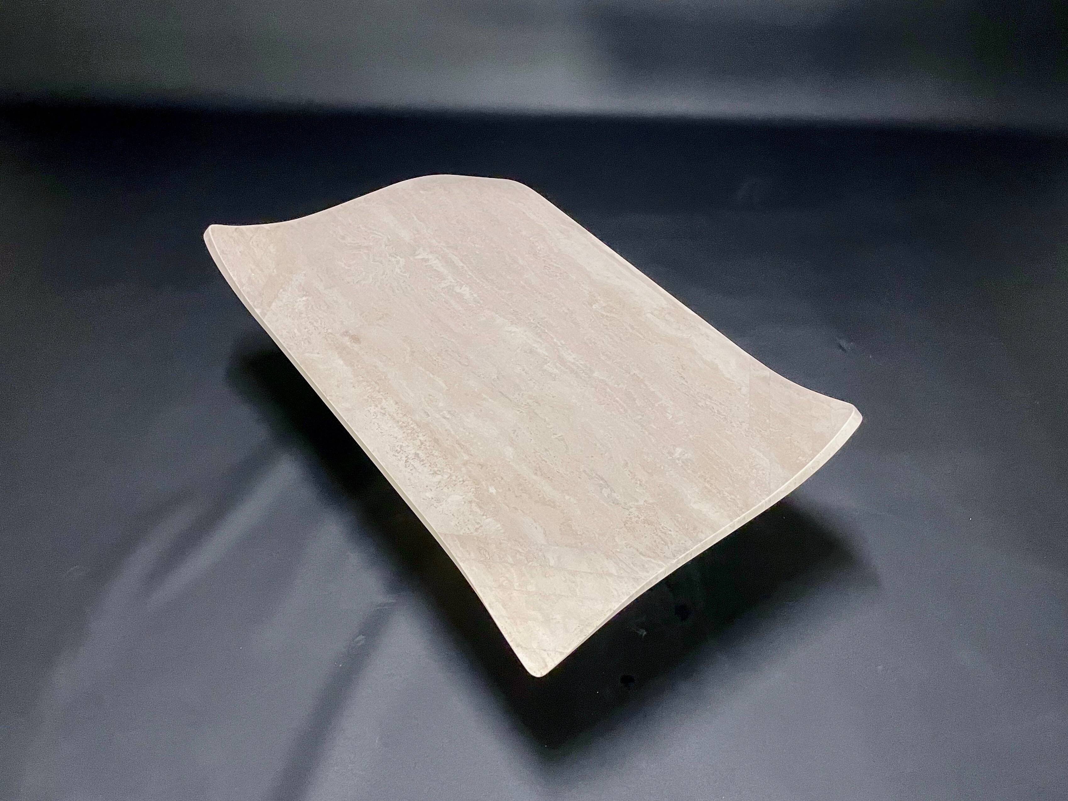 Travertine coffee table with curved corners by Claude Berraldacci. 1990s. France.
