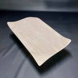 Travertine coffee table with curved corners by Claude Berraldacci. 1990s. France.