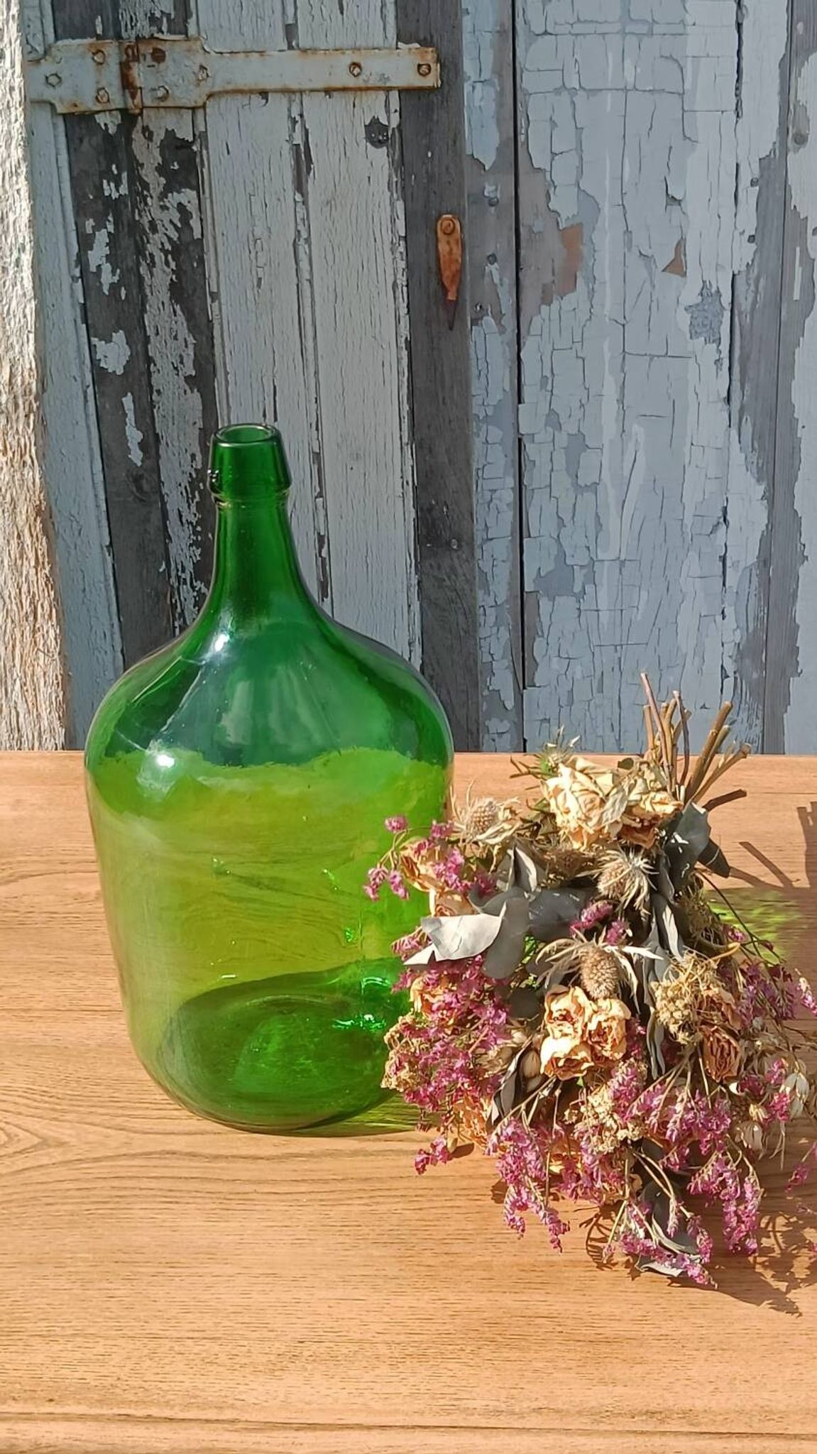 Superb antique green glass demijohn.
