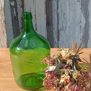 Superb antique green glass demijohn.