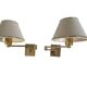 Pair of vintage brass wall lights with adjustable arms.